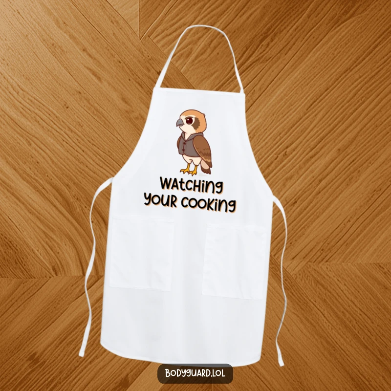 Funny hawk apron with a vigilant hawk wearing a small vest, scanning the horizon, ready to monitor kitchen activities.